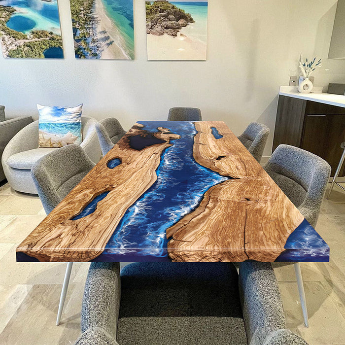 Custom ocean blue epoxy resin dining table with natural wood grain and elegant river design.