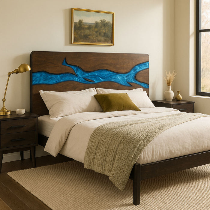 Bedroom with wooden bed frame featuring blue resin design, nightstands, and decor.
