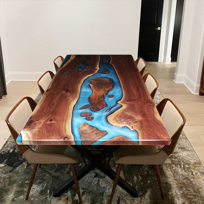 Custom-made blue resin wood table designed for 8-person dining space with elegant chairs