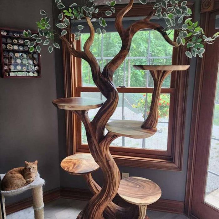 Wooden cat tree with multiple levels and a cat sitting on one of the platforms.