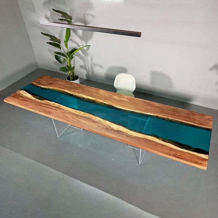 Extra-long epoxy river dining table crafted with live edge walnut wood, featuring a crystal-clear blue resin river for a striking centerpiece design.