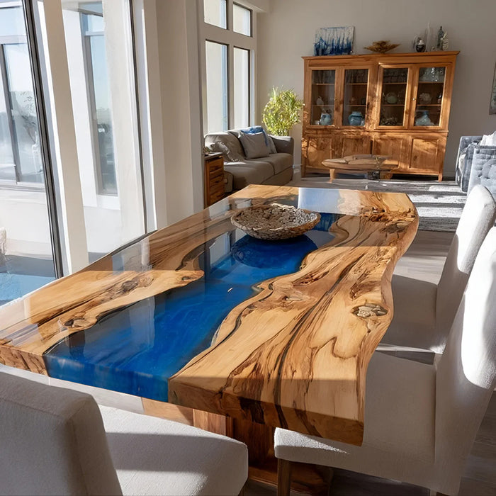 Olive wood live edge dining table with blue epoxy river centerpiece.
