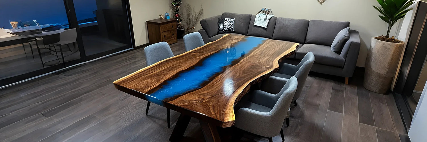 Custom ocean blue epoxy river table crafted from black walnut slab with natural live edge. A luxurious blend of deep blue resin and rich walnut grain, ideal for dining or conference spaces.