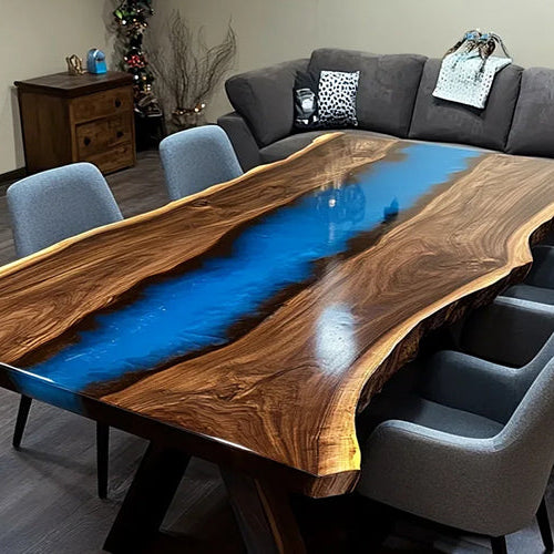 Custom ocean blue epoxy river table crafted from black walnut slab with natural live edge. A luxurious blend of deep blue resin and rich walnut grain, ideal for dining or conference spaces.
