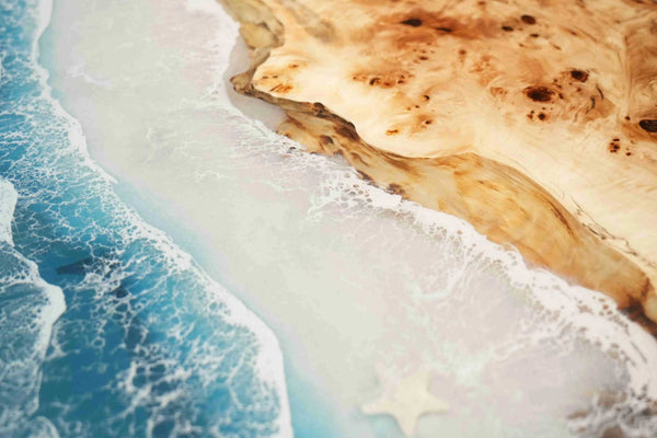 Close-up of a rocky shoreline with ocean waves.