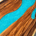10-person walnut epoxy river dining table with blue accents