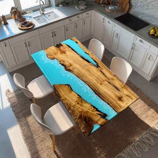 Close-up showing the crystal-clear light blue epoxy resin and natural golden camphor wood grain.