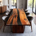 Dining room with a large wooden table and chairs in a modern interior setting.