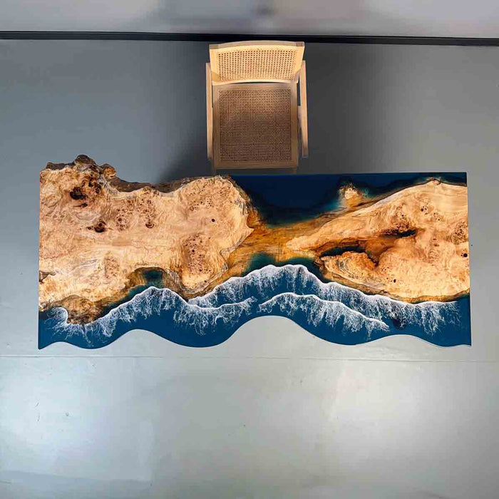 Tabletop with natural wood design and ocean wave pattern on a reflective surface.