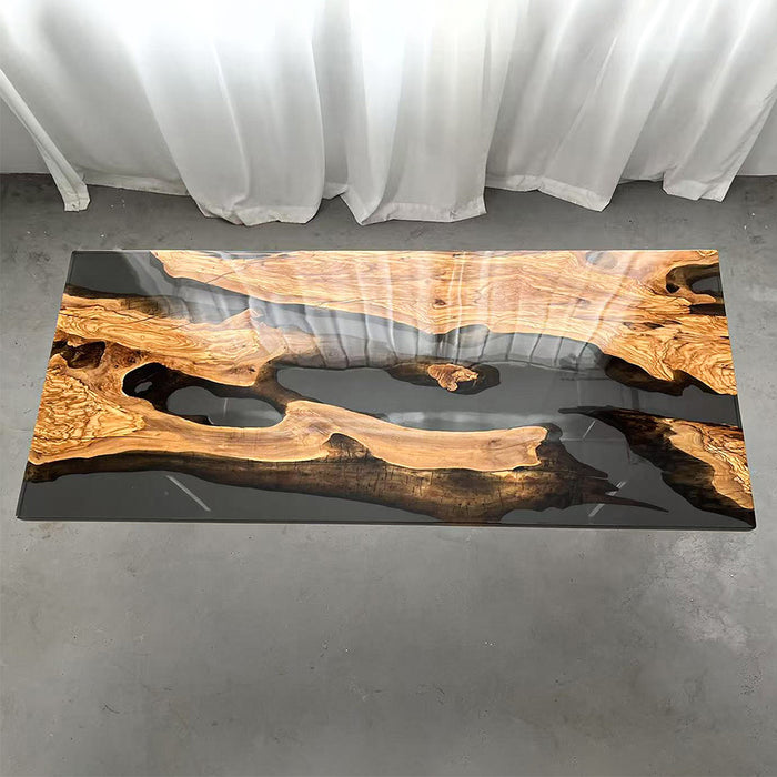 Artistic resin and olive wood table styled in a modern office atrium