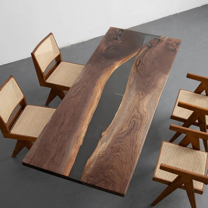 Live‑edge black walnut epoxy river dining table paired with solid wood rattan dining chairs, modern rustic furniture