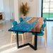 Custom walnut river dining table with deep blue epoxy