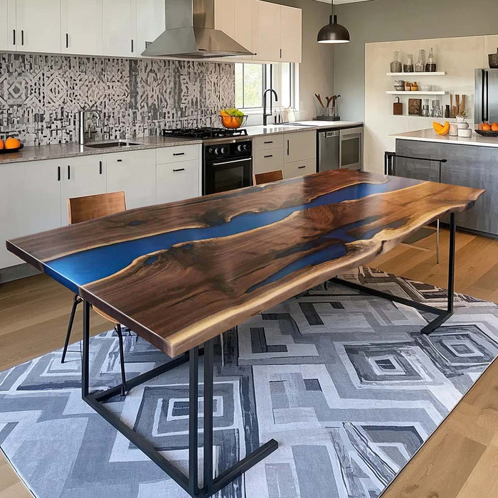 Custom walnut epoxy river table with bold blue resin for dining room