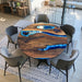 Black epoxy resin river dining table with live edge wood