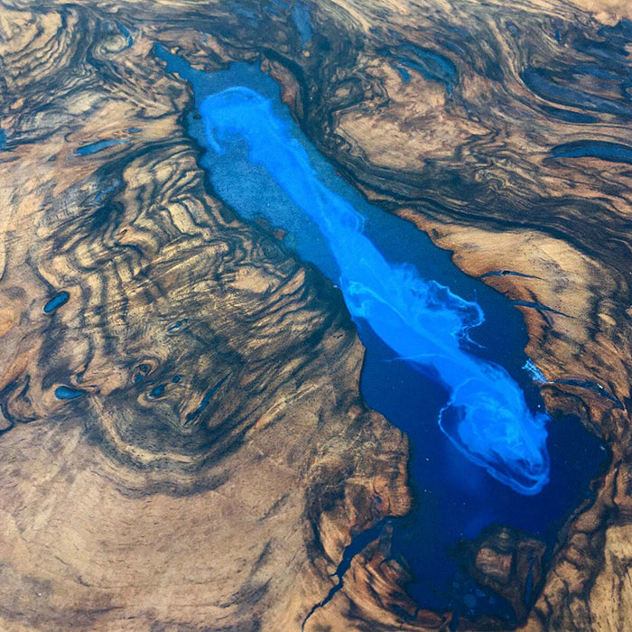 Handmade walnut wood epoxy resin tabletop close-up