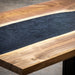Handcrafted walnut epoxy table with custom black river resin center.
