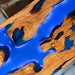 Wooden table with blue resin inlay