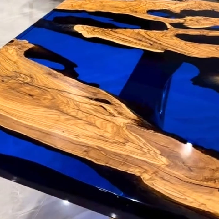 Handmade live edge epoxy river table with rich burl wood grain