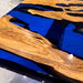 Handmade live edge epoxy river table with rich burl wood grain