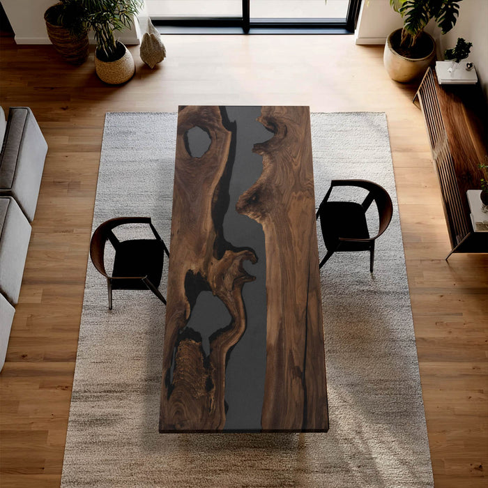 Dark epoxy river table made from natural live‑edge walnut wood for modern home interiors