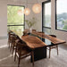 Custom handcrafted black walnut live edge table with black resin.