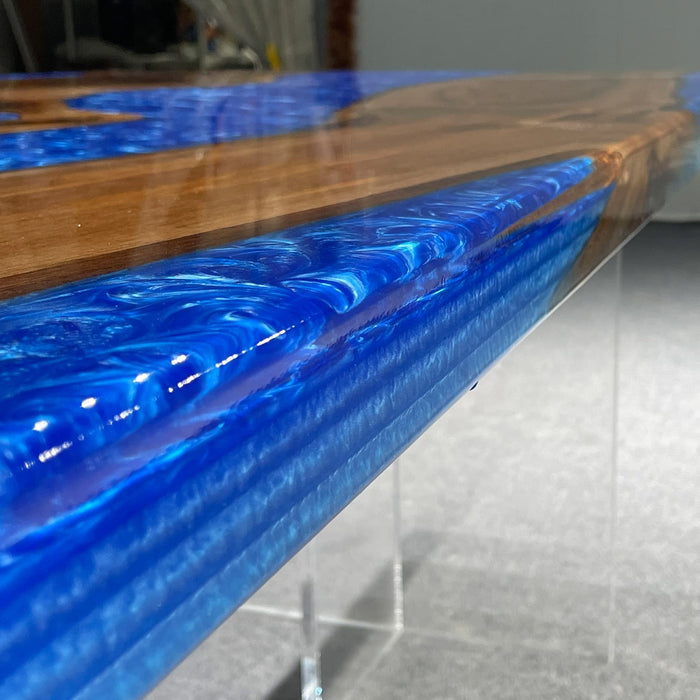 Tabletop with blue resin and wood design on a gray surface