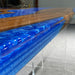 Tabletop with blue resin and wood design on a gray surface