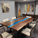 Modern conference room with a unique wooden table featuring a blue resin inlay.