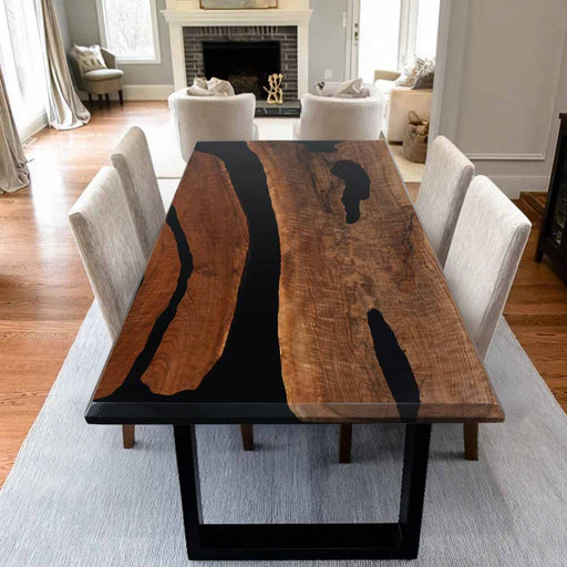 Dining table with black resin inlay in a living room setting