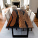 Dining table with black resin inlay in a living room setting