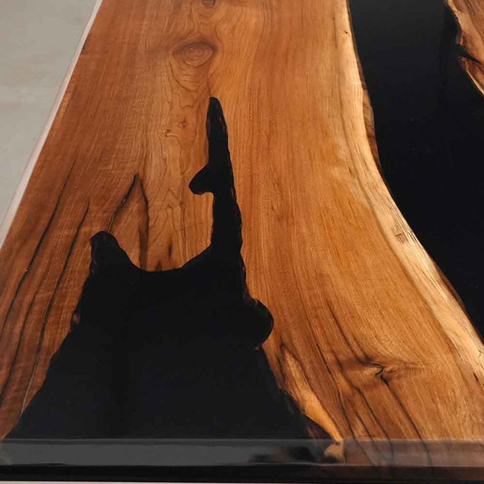 Wooden surface with a black hand reaching towards it