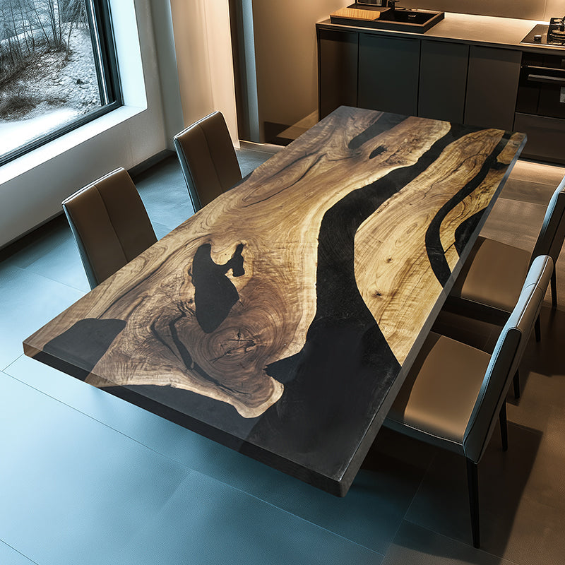 The Custom Black Epoxy Smooth Dining Table is a masterpiece, blending the raw beauty of nature with a modern minimalist style. The tabletop is crafted from carefully selected high-quality wood, paired with deep black resin that flows like a river. The intricate details of the resin flow are vibrant and unique, showcasing the perfect union of craftsmanship and nature. With its sleek design, it effortlessly complements both modern and classic decor, becoming the focal point of any space. The sturdy legs provi