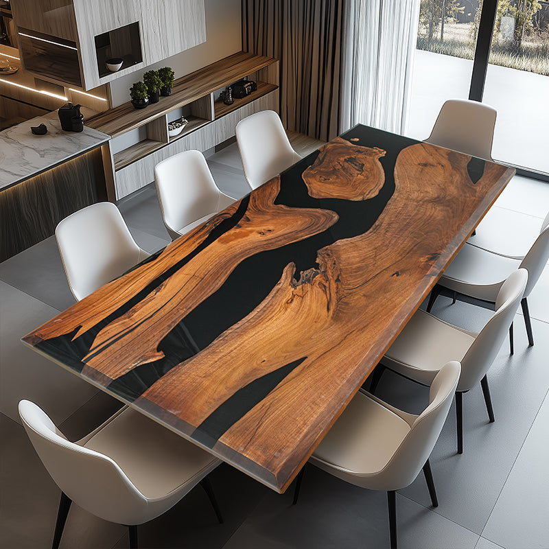 The Custom Black Walnut Epoxy River Table showcases a black walnut live edge slab, seamlessly combined with high-quality epoxy resin to create a stunning contrast. The table top epoxy finish enhances the natural wood grain while providing durability and a glossy shine. Perfect as an epoxy dining table, conference table, or a statement wood and epoxy table for modern interiors. Designed with acrylic legs, this epoxy resin wood table exudes elegance and sophistication. 