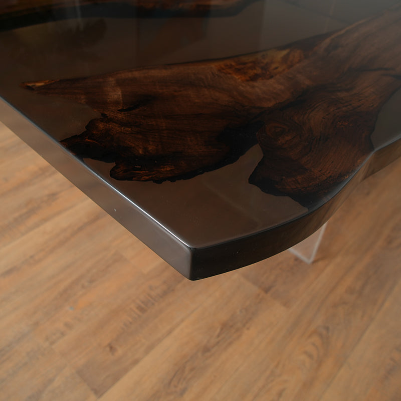 The Custom Black Walnut Live Edge Epoxy River Table features a beautifully crafted black walnut live edge slab, seamlessly infused with high-quality epoxy resin to create a mesmerizing river-like flow.It is an ideal choice as an epoxy dining table, epoxy resin conference room table, or a luxury wood and epoxy table for contemporary spaces. Perfect for those seeking a unique statement piece, this epoxy resin river table blends nature and craftsmanship in a timeless design. 