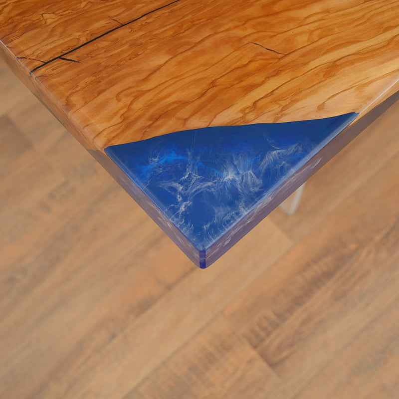 Blue epoxy resin river table with natural wood slab and high-gloss finish