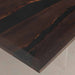 Dark wooden table with a glossy finish on a light background