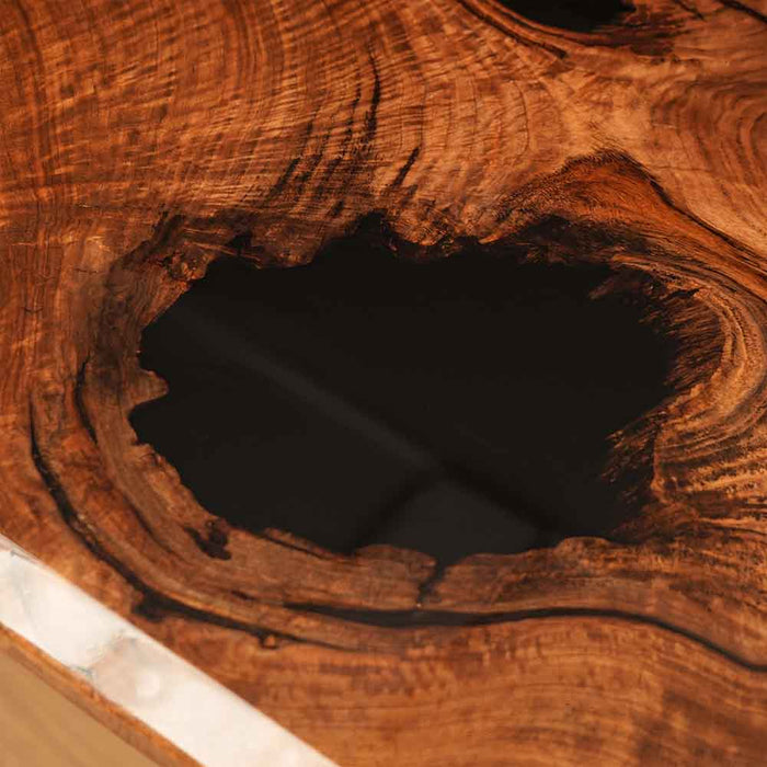Close-up of a wooden surface with a large knot