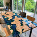 Dining table with wood and colorful epoxy resin, unique artisan design.