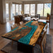 Dining room with a unique wooden table featuring a blue resin river design.