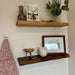 Wooden shelves with decorative items on a wall