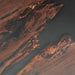 Close-up of a wooden surface with dark brown and black patterns
