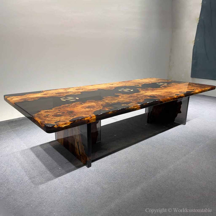 Luxury resin river table crafted from golden camphor wood with a dramatic black epoxy center.