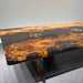 Live edge golden camphor epoxy dining table showcasing organic edges and unique hardwood character.