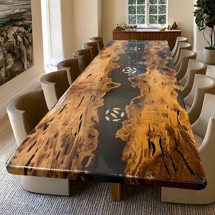 Modern black epoxy river design contrasted with the warm tones of a premium golden camphor slab.