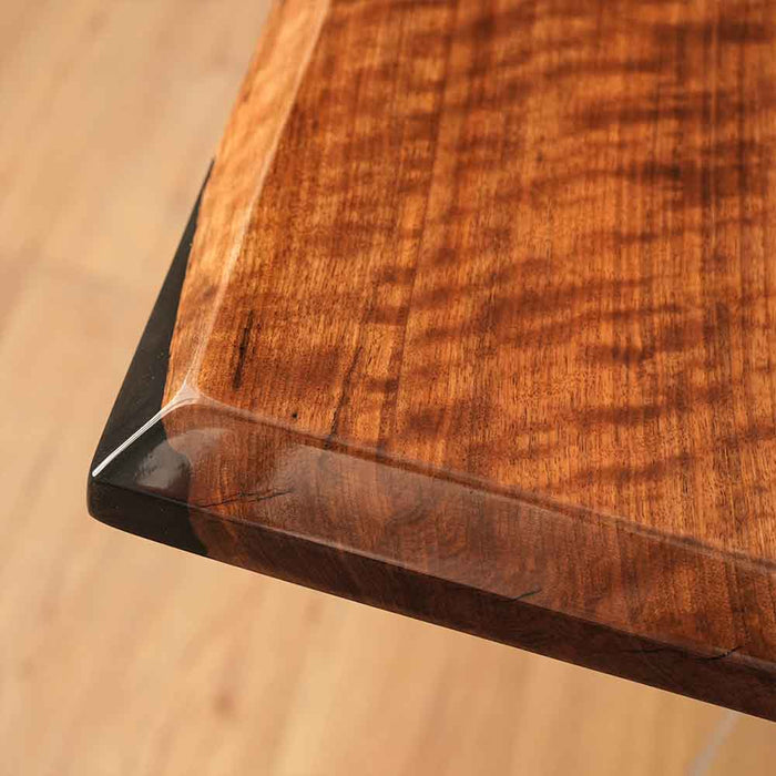 Close-up of a wooden cutting board with a blurred background