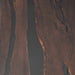 Aerial view of a deep canyon with steep rock walls.