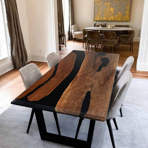 Dining room with a wooden table and chairs in a well-lit room.