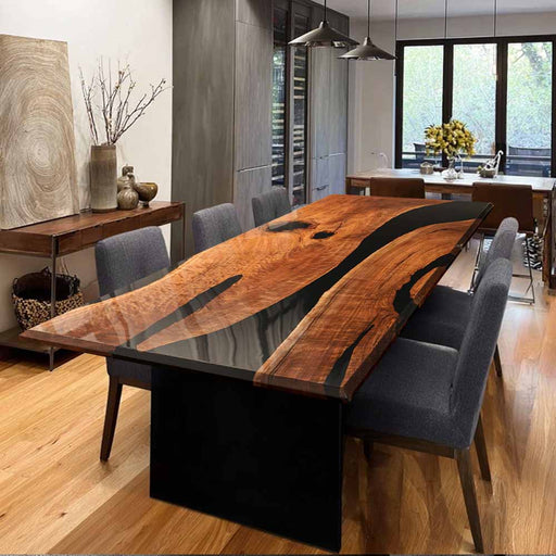 Dining room with a long wooden table and gray chairs.