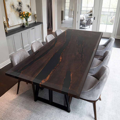 Dining room with a dark wooden table and gray chairs.