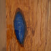 Modern custom-designed wood table with blue epoxy river, crafted from premium walnut.